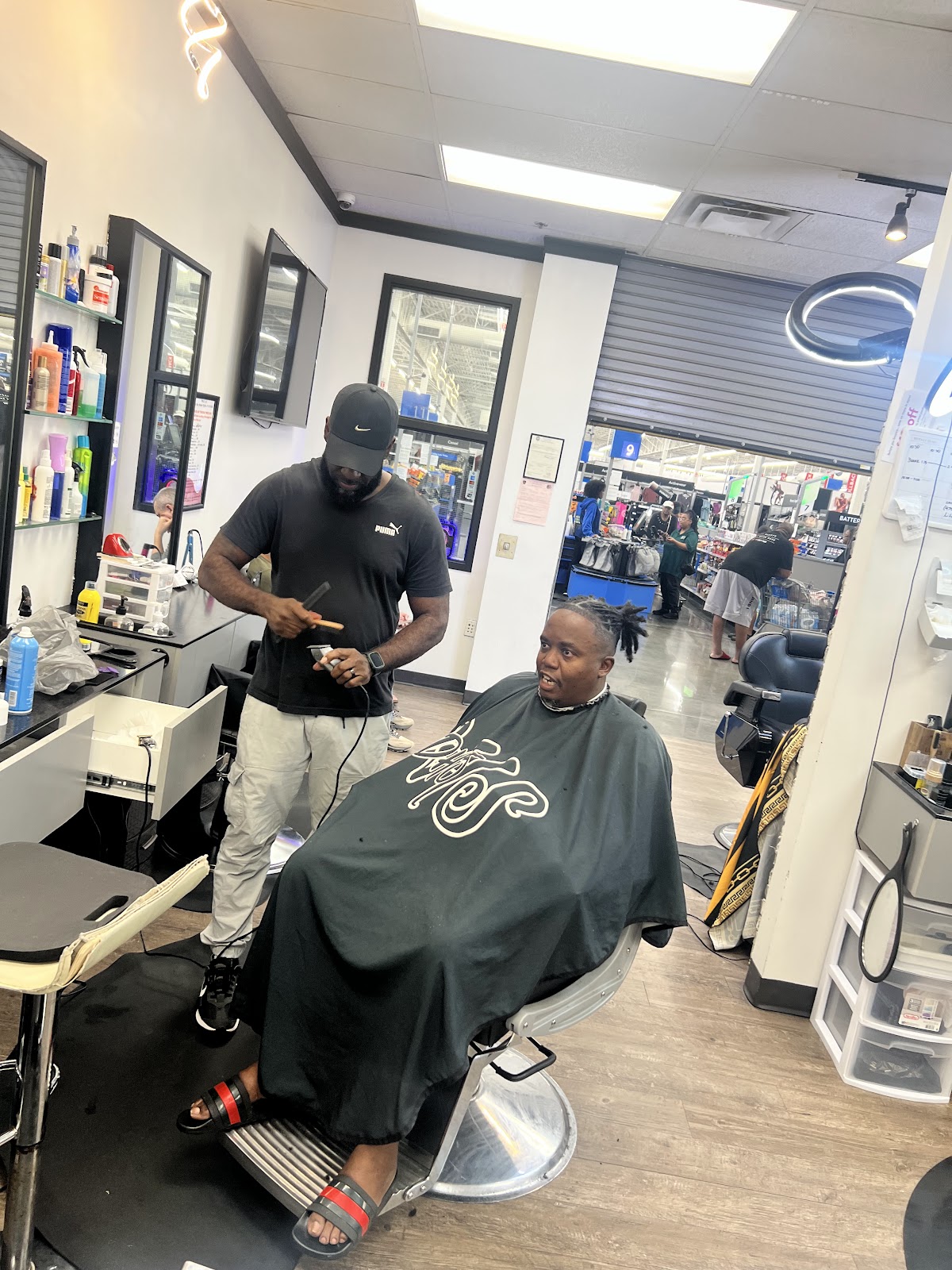 Barber lining up a client's cut at 354 Hair Studios in Stockbridge, GA
