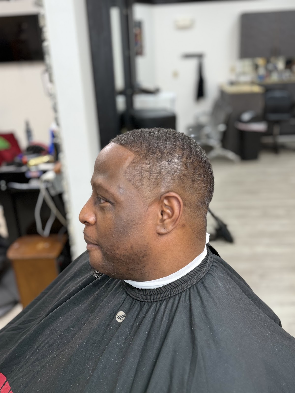 Clean taper fade and line-up, side profile, finished at 354 Hair Studios